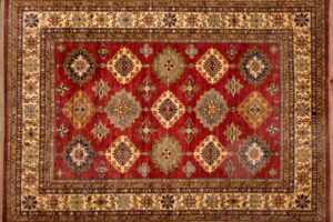 Kazak rectangular 8' 3" by 10' 1" rug with geometric pattern from Pakistan - Red & Ivory