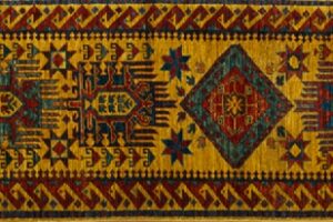 Kazak runner 2' 6" by 9' 8" rug with geometric pattern from Afghanistan - mustard & rust